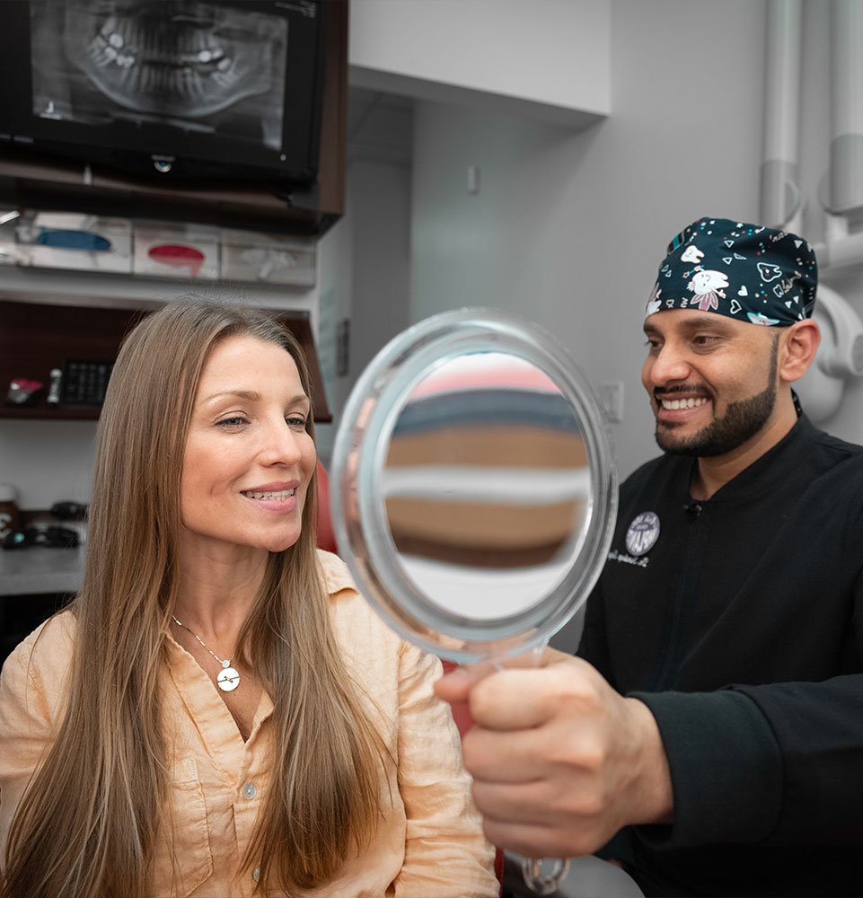 patient smiling brightly after finishing dental procedure