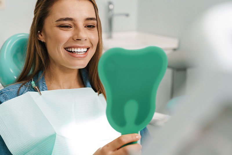 patient smiling brightly after their dental procedure